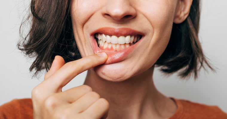 Woman pulling on her lower lip